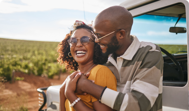 Couple hugging in a field